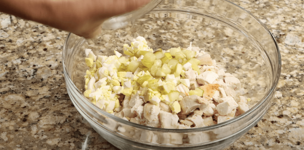 Combining the ingredients for the chicken salad